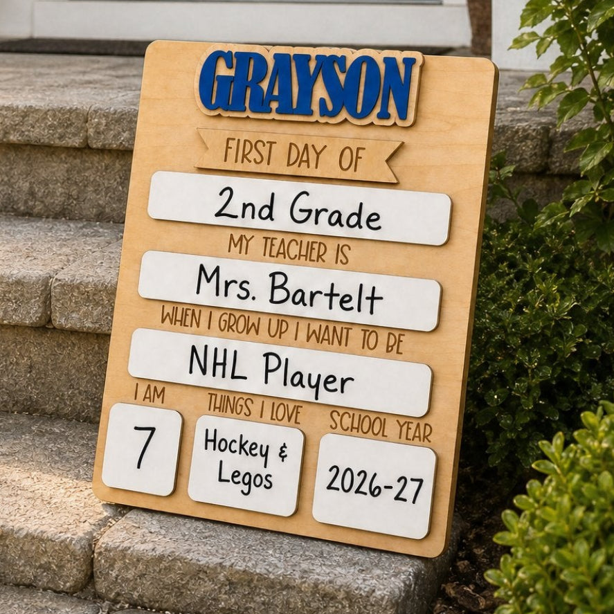 Personalized rectangle first day of school sign leaning on stone steps lifestyle photo — maple wood reusable school milestone board