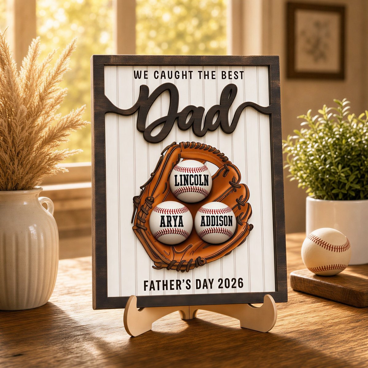 Personalized Father's Day baseball desk plaque for Dad. Custom kids' name wooden sign featuring a 3D baseball glove, rustic frame, and three customized baseballs on an easel stand.