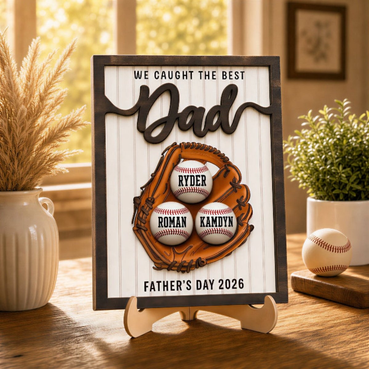 Personalized Father's Day baseball desk plaque for Dad. Custom kids' name wooden sign featuring a 3D baseball glove, rustic frame, and three customized baseballs on an easel stand.
